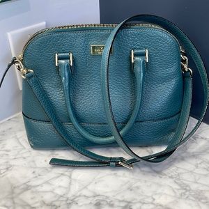 Teal Kate Spade handbag with detachable strap.